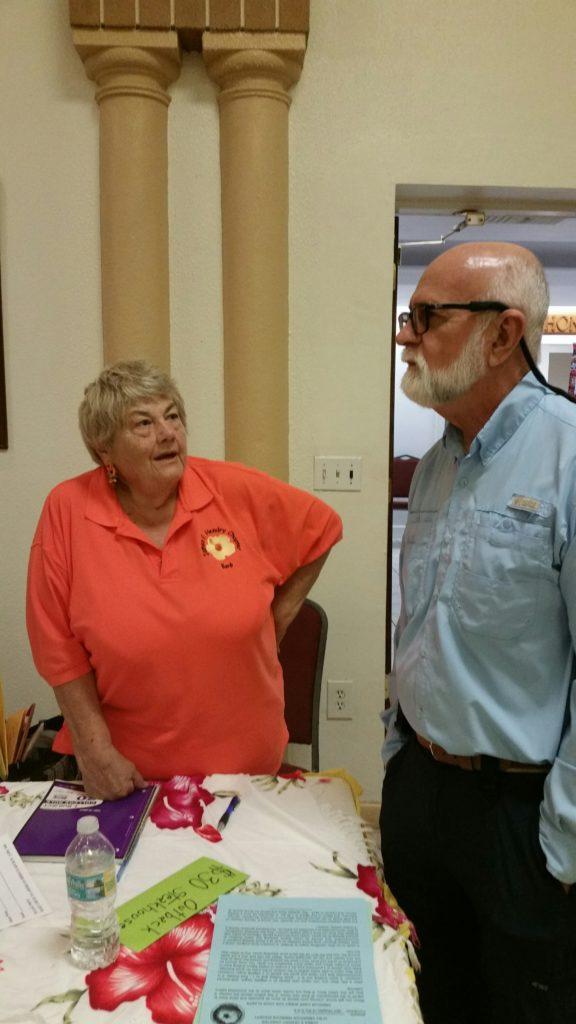Two people having a conversation indoors.